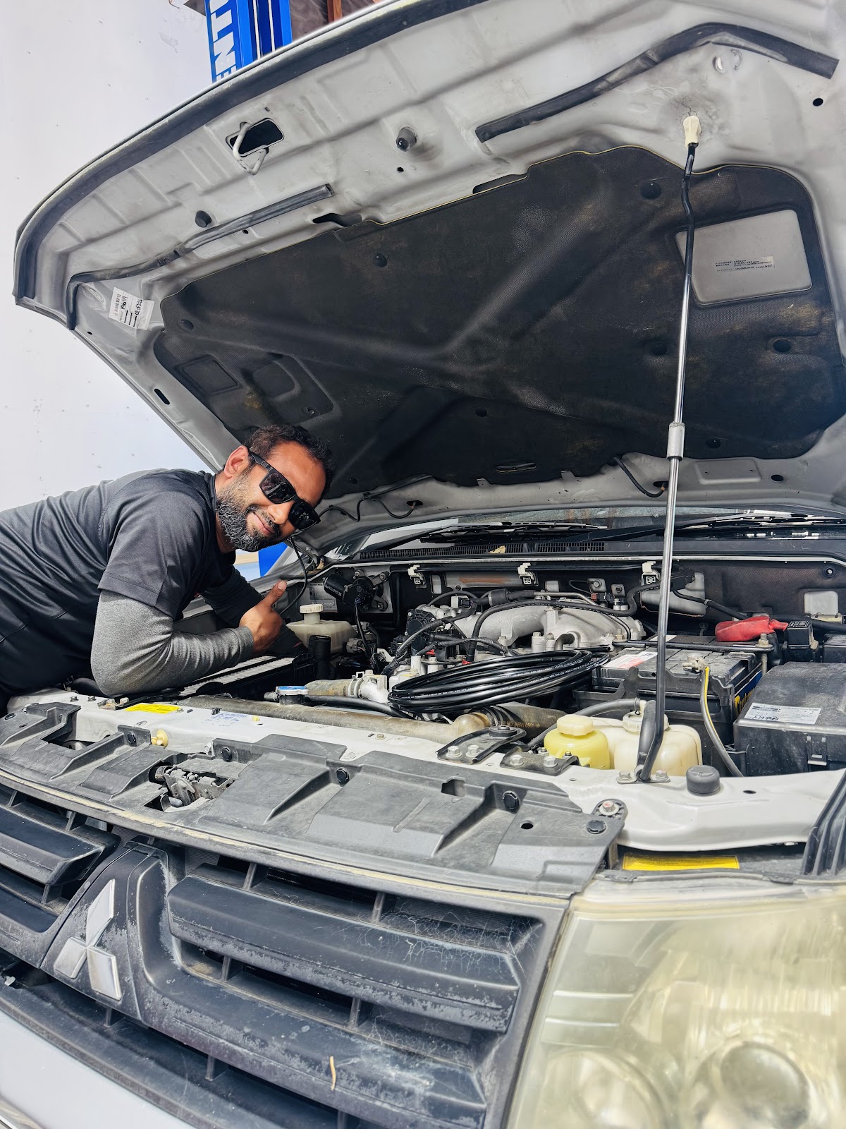 A 99 Automobiles mechanic at work in the Central Dunedin workshop